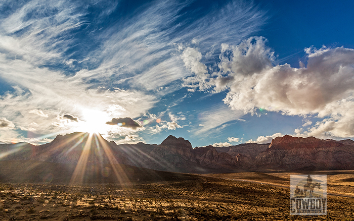 Cowboy Trail Rides - Setting sun over Wilson Cl;iffs